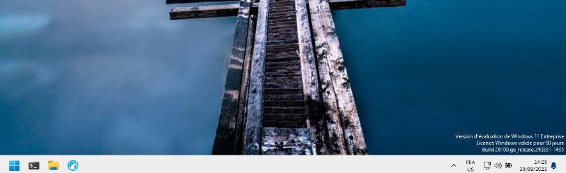 Capture d'écran de la bare de tache de la VM Windows 11 une fois les ajustements précités effectués.